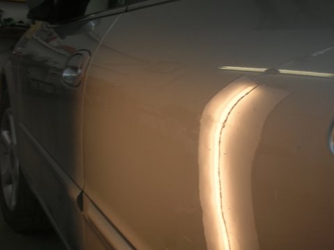 After paintless dent removal on maxima door
